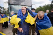 Ukrainian POWs are seen after a swap at an unknown location in Ukraine