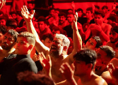 Shi'ite Muslims beat their chests during a religious ritual marking Ashura, the holiest day on the Shi'ite Muslim calendar, in Baghdad