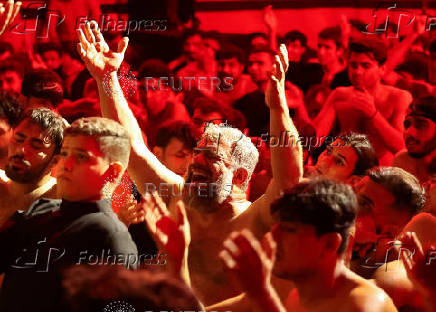 Shi'ite Muslims beat their chests during a religious ritual marking Ashura, the holiest day on the Shi'ite Muslim calendar, in Baghdad