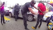 A police officer searches William McNeil Jr at an unidentified location, in Florida