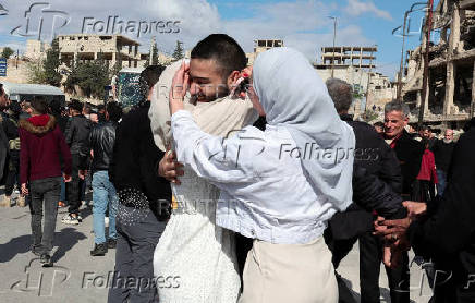A family welcomes their released husband in today's prisoner exchange in Aleppo