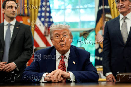 U.S. President Donald Trump signs executive orders at the White House in Washington