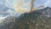 Smoke rises from the Summit Lake wildfire G90413 west of Fort Nelson