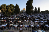 Palestinians pray on the first day of the Muslim holiday of Eid al-Adha, in Jerusalem's Old City