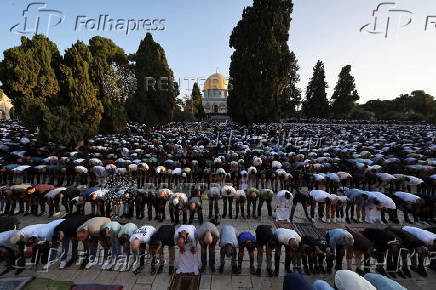 Palestinians pray on the first day of the Muslim holiday of Eid al-Adha, in Jerusalem's Old City
