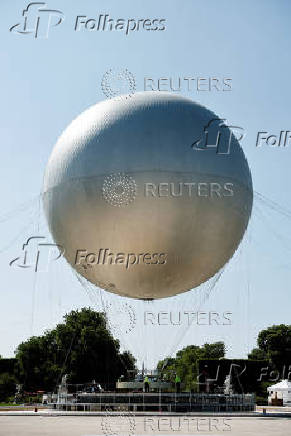The return of a new Paris 2024 flame cauldron set on a balloon to the Tuileries Garden and the Paris skyline