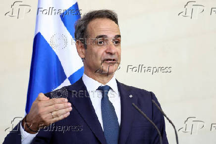 FILE PHOTO: Greek PM Mitsotakis visits Germany