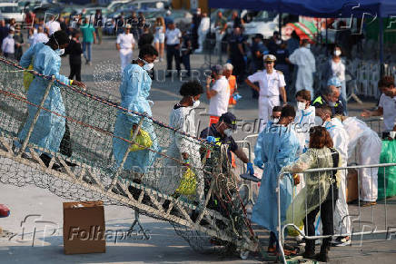 Rescued migrants disembark Sea-Watch 5 ship in Salerno