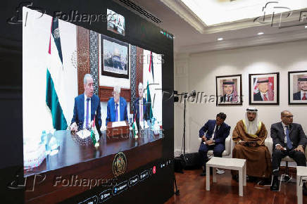 Members of the Ministerial Committee Assigned by the Joint Extraordinary Arab-Islamic Summit on Gaza meet with Palestinian President Abbas through video conferencing, in Amman