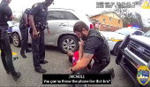 A police officer searches William McNeil Jr at an unidentified location, in Florida