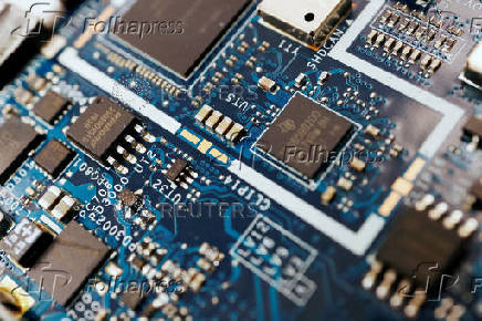 FILE PHOTO: Illustration picture of semiconductor chips on a circuit board