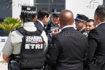 U.S. Secretary of State Marco Rubio talks with National Guard members before boarding his plane at Felipe Angeles International Airport in Zumpango, on the outskirts of Mexico City