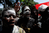 Partisans of PDCI (Democratic Party of Cote d'Ivoire) protest at their headquarters in Abidjan