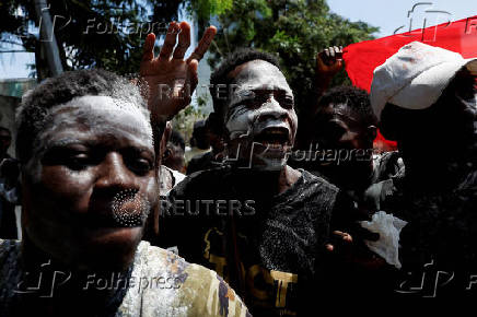 Partisans of PDCI (Democratic Party of Cote d'Ivoire) protest at their headquarters in Abidjan