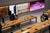 People visit Apple's Fifth Avenue store in New York City