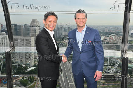 A handout picture shows Singapore's Minister of Defence Chan Chun Sing meeting U.S. Secretary for Defense Pete Hegseth on the sidelines of the 22nd Shangri-La Dialogue, in Singapore