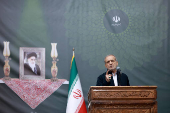 Iranian President Masoud Pezeshkian speaks during the 36th anniversary of the death of the leader of Iran's 1979 Islamic Revolution, Ayatollah Ruhollah Khomeini, at Khomeini's shrine in southern Tehran