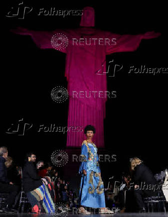 Models present creations by Alessa at the Christ the Redeemer statue to mark the launch of Rio Fashion Show, in Rio de Janeiro