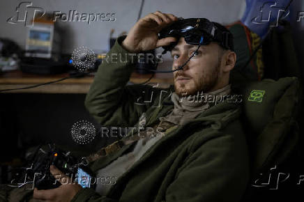 Ukrainian service member is seen at a position while he operates FPV-drones near the front line town of Kupiansk