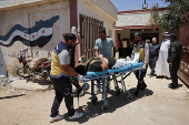 Casualties from recent clashes in Sweida receive treatment at a field medical point in Deraa