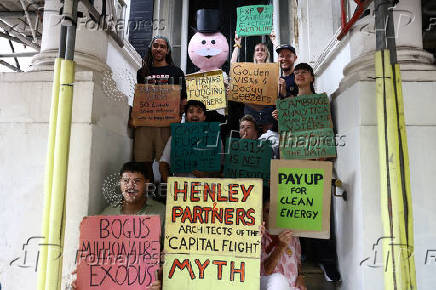 Green New Deal Rising protest outside Henley & Partners in London