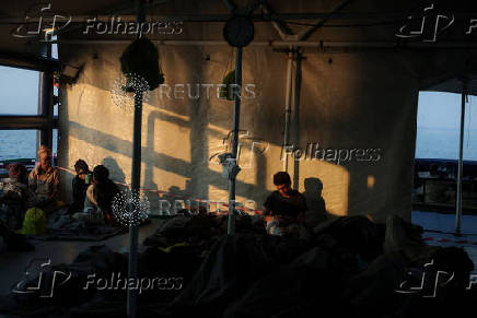 Rescued migrants arrive aboard Sea-Watch 5 ship in Salerno