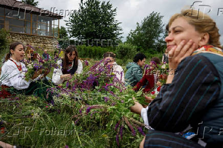 People take part in a celebration on the traditional Ivana Kupala in the village of Vytachiv, in Kyiv region