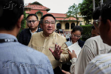Thailand's Deputy Finance Minister Julapun Amornvivat speaks to media members after a cabinet meeting at the Government House, in Bangkok