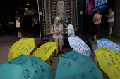Demonstrators gather during a 
