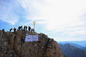 People display a banner reading: 
