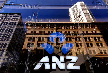FILE PHOTO: The logo of the ANZ Banking Group is displayed in the window of a newly opened branch in central Sydney, Australia