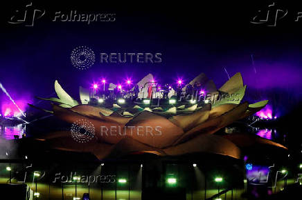 Mariah Carey performs on a floating stage shaped like a giant Victoria amazonica water lily at the Guama River in Belem