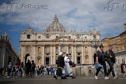 Nuns walk at St. Peter's Square in the Vatican