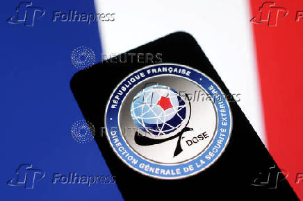Illustration shows DGSE (Direction Generale de la Securite Exterieure) logo and France flag