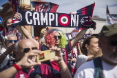 Players of Bologna FC and fans celebrate in Bologna