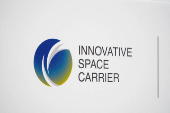 The logo of Innovative Space Carrier is displayed at a press conference in Yokohama