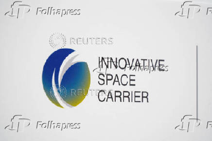 The logo of Innovative Space Carrier is displayed at a press conference in Yokohama