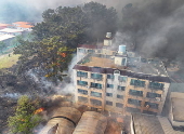 Wildfire burns near a residential neighborhood