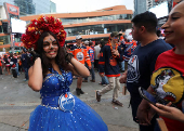 Edmonton Oilers fans react in a fan zone during the first game of the Stanley Cup Finals against the Florida Panthers, in Edmonton
