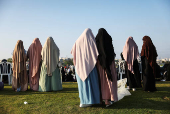Israeli Muslims pray on the first day of the Muslim holiday of Eid al-Adha by the sea side of the Mediterranean, in Jaffa