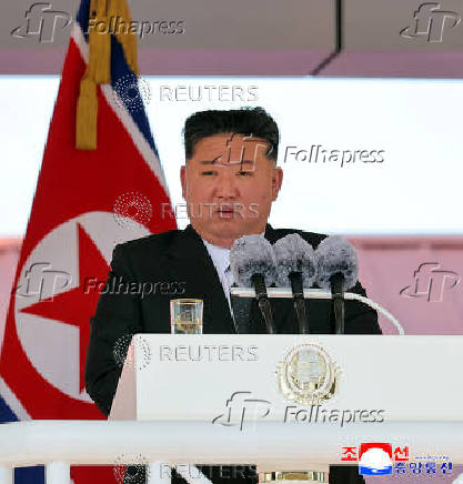 North Korean leader Kim Jong Un attends the launching ceremony of a warship that had been damaged upon its first attempt to launch