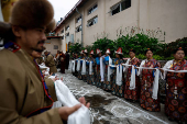 Tibetans mark the 90th birthday celebration of their spiritual leader, the Dalai Lama, at Jawalakhel Handicraft Center in Lalitpur