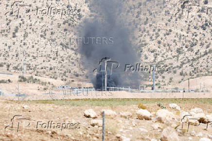 Smoke rises after a drone attack targeted oil facilities in the Zakho area of Iraq's Kurdistan region