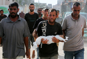 Palestinian father mourns 3-month-old who died due to malnutrition, according to medics, in Khan Younis