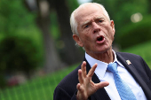 Peter Navarro speaks to the media outside the White House