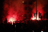 Champions League - Fans celebrate after Paris St Germain qualifies for the final