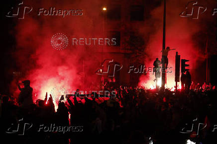 Champions League - Fans celebrate after Paris St Germain qualifies for the final