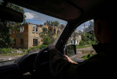 A Ukrainian serviceman rides a car in the frontline town of Kostyantynivka