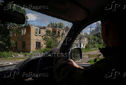 A Ukrainian serviceman rides a car in the frontline town of Kostyantynivka