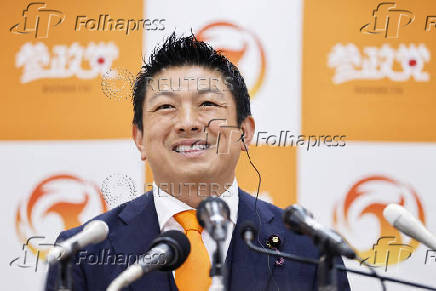 Japan?s opposition Sanseito party leader Sohei Kamiya smiles on the day of the upper house election in Tokyo